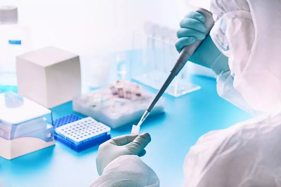 Lab technician pipetting samples for analysis
